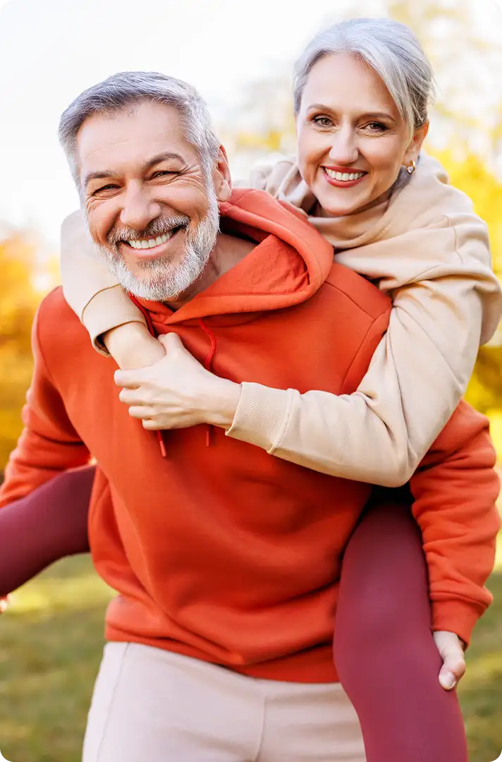 A senior couple enjoy the outdoors after advanced cataract surgery.