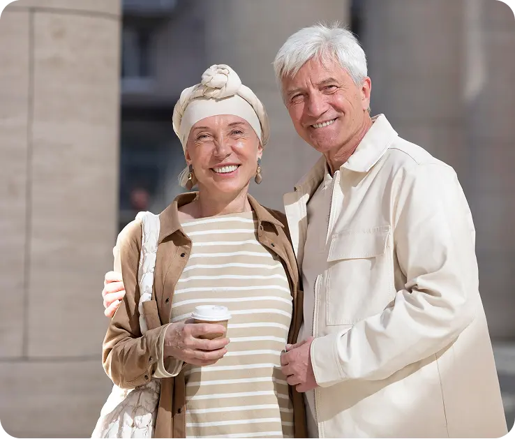 Happy senior couple looking at camera